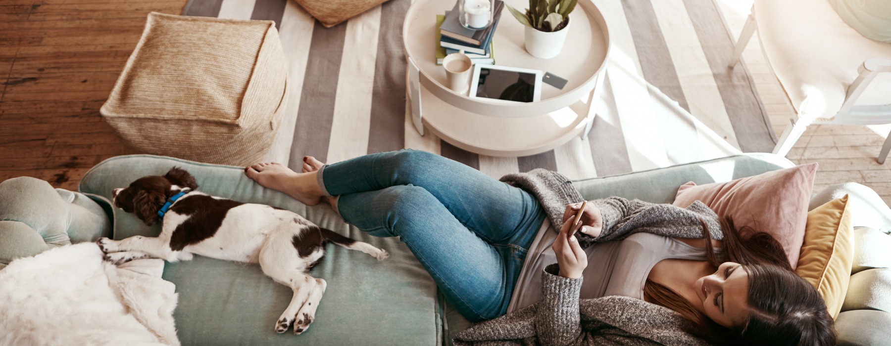 Woman relaxing on the couch with her dog